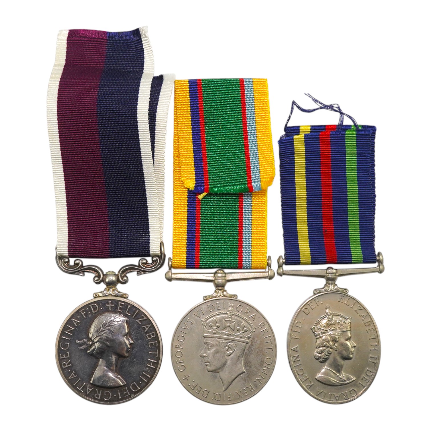 Three assorted service medals; GVI Cadet Forces medal to ACT. FG. Off. A. Liddell R.A.F.V.R (T); ERII Civil Defence Long Service medal unnamed; ERII RAFLSGC to E2418184 Cpl G R B Lowe RAF. Condition - fair to good.